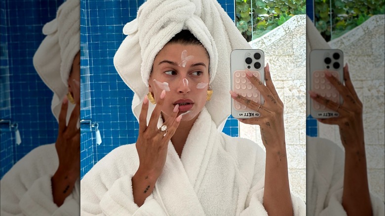 Hailey Bieber taking mirror selfie