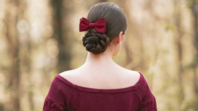 Low bun with red hair bow