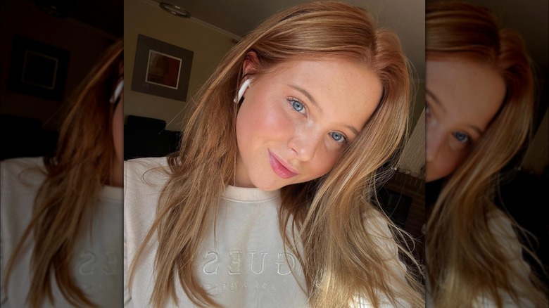 A woman with strawberry blond hair