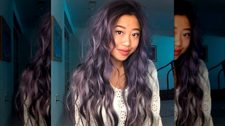 A woman with purple hair