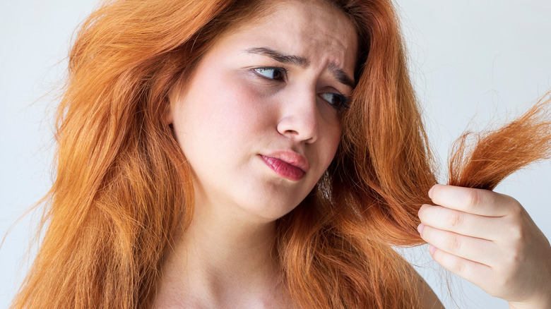 Woman with brassy damaged hair