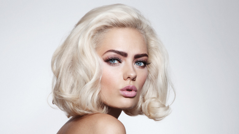 Blonde woman with dark eyebrows