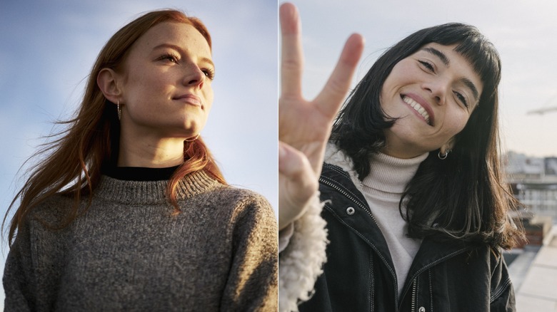 Two women posing for photos outside.