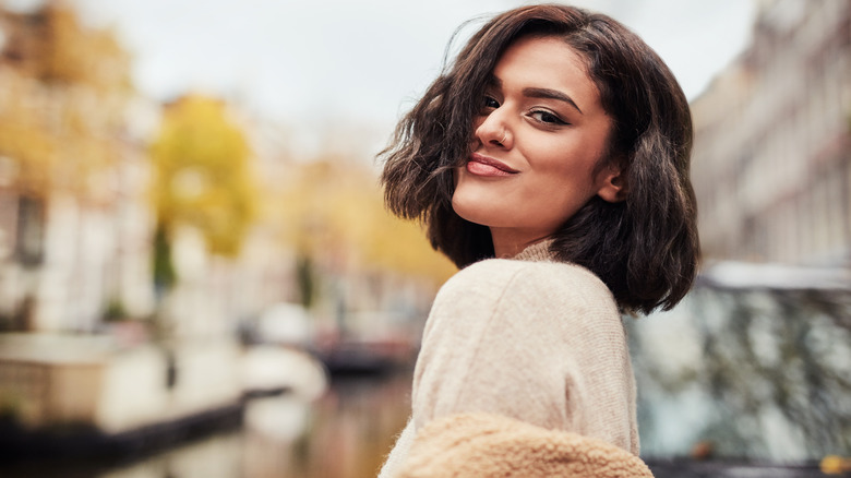 A woman with a short bob haircut posing for the camera.