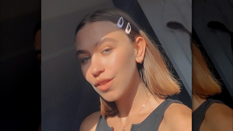 Girl wearing snap clips