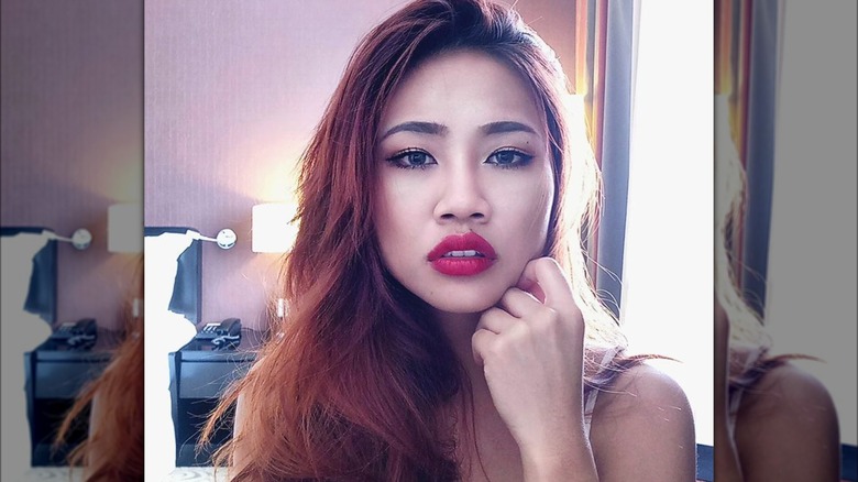 Woman with a deep side-part