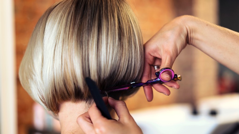 A hairstylist cutting a bob
