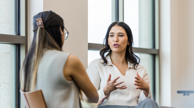 Women in serious conversation