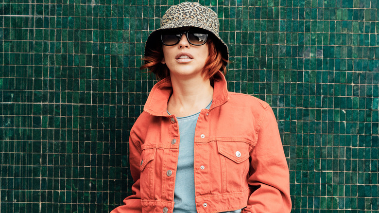 A woman wearing a bucket hat.