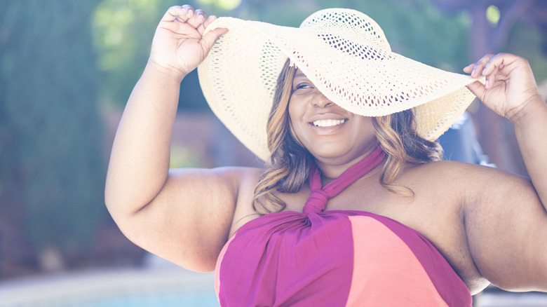 A woman wearing a floppy hat.