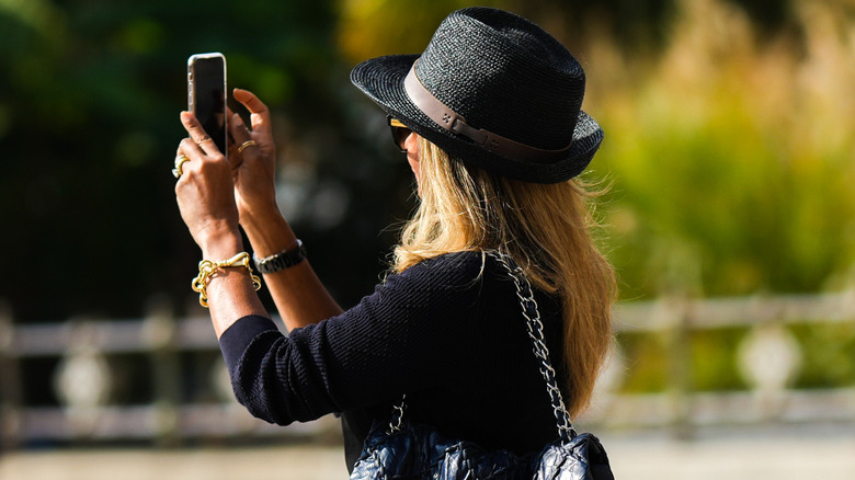 A woman wearing a Panama hat.
