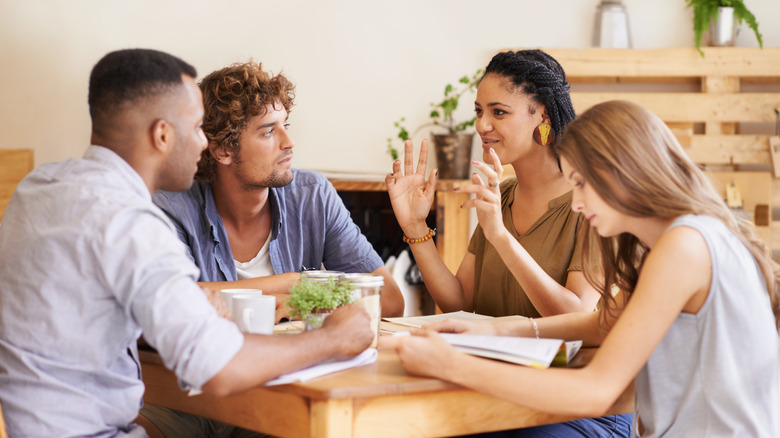 Four friends at a cafe