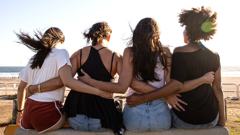 Four friends by the beach