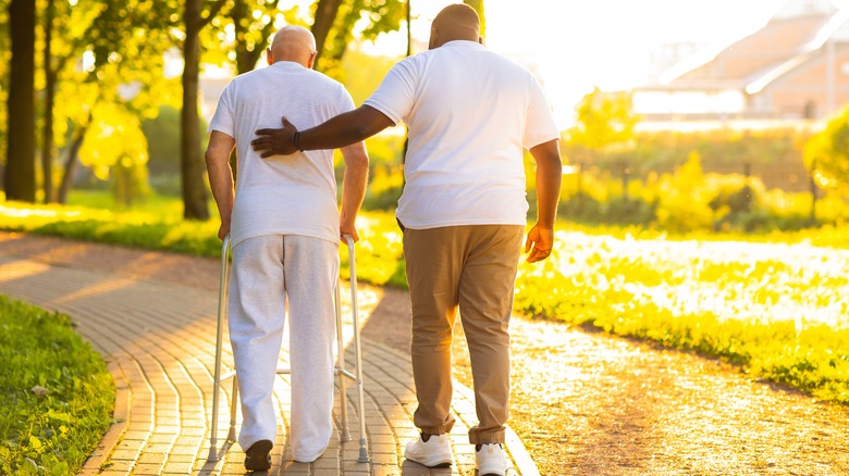 A nurse walks with patient