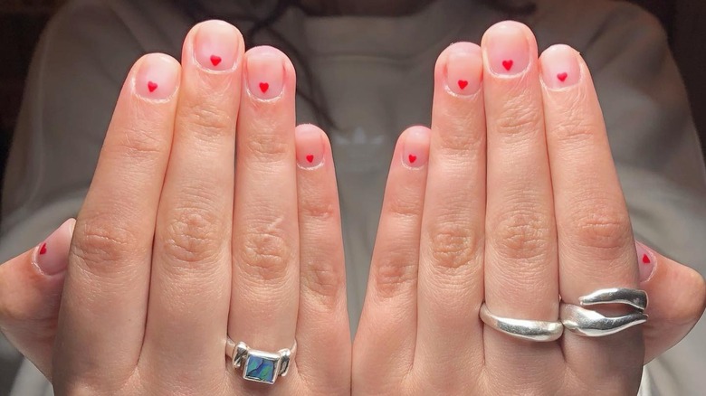 Tiny red heart nail art