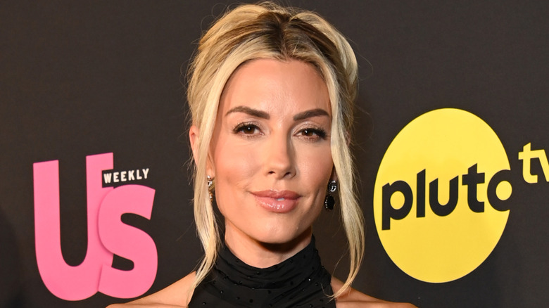 Heather Rae El Moussa wearing an updo on a red carpet