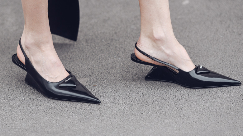 A woman wearing heels with too-pointed toes