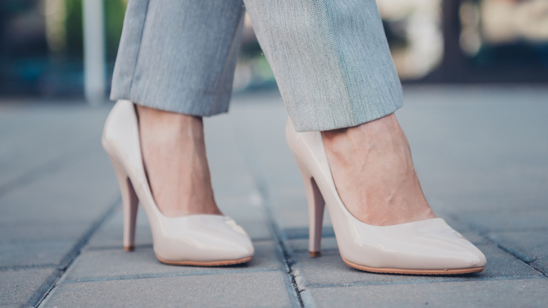 A woman wearing outdated plain heels