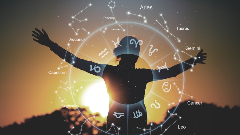 woman looking at zodiac signs