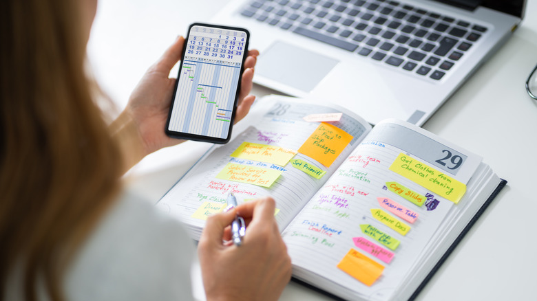woman making plans and looking at calendar