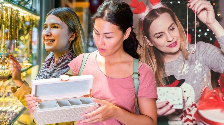 Three women looking at jewelry