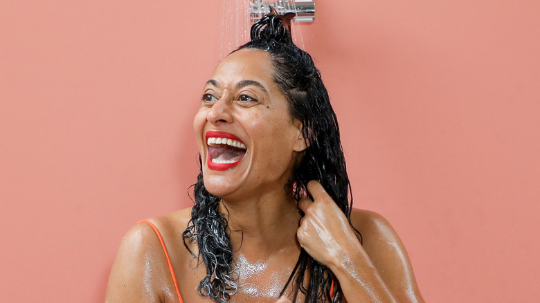 female shampooing in the shower