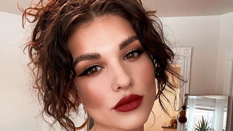 Updo with hanging curtain bangs