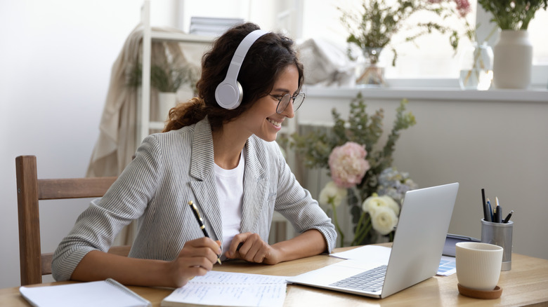 woman smiling at laptop