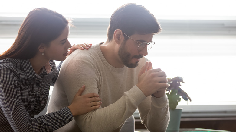 woman comforting partner