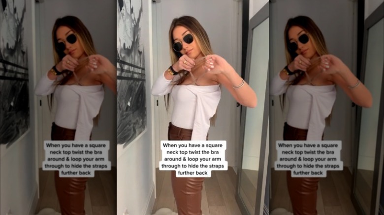 Woman doing bra hack