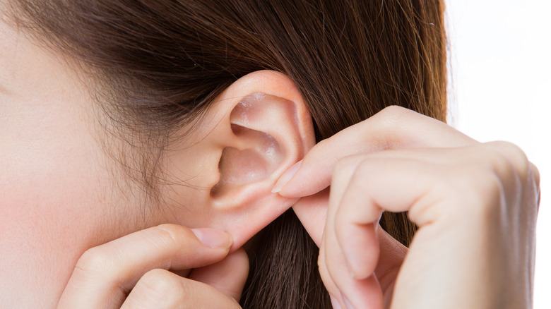 young woman earlobe