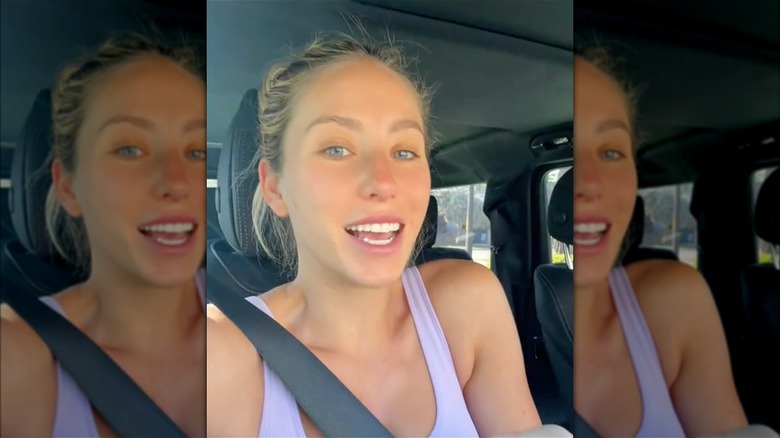 Alix Earle makeup-free and smiling