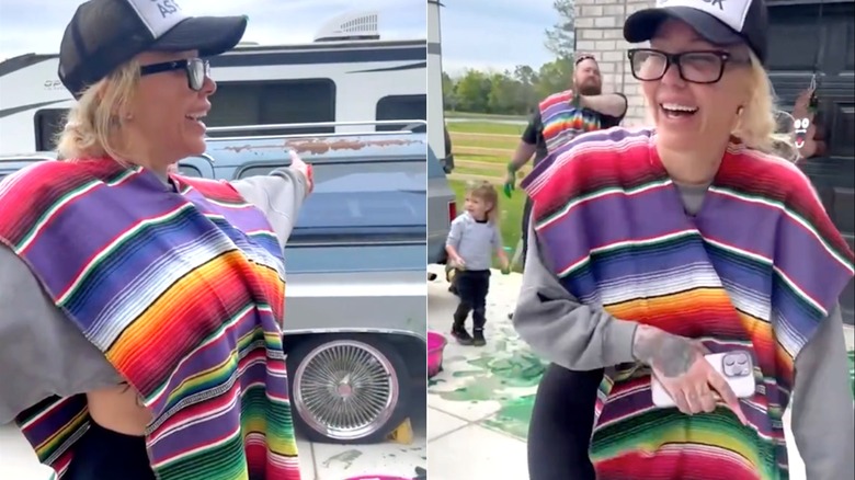 Bunnie Xo wearing glasses and a poncho