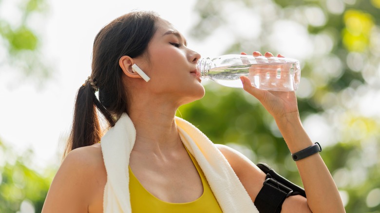 Young woman drinking water