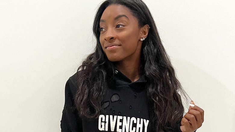 Simone Biles wearing Givenchy hoodie dress