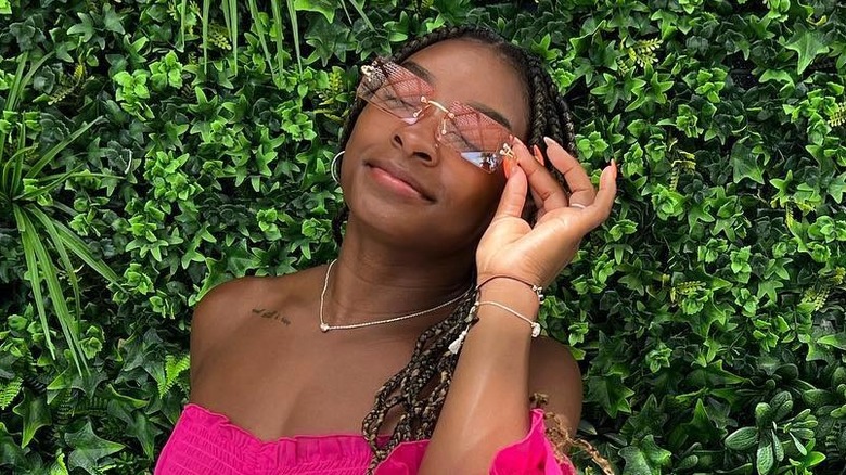 Simone Biles wearing pink sunglasses