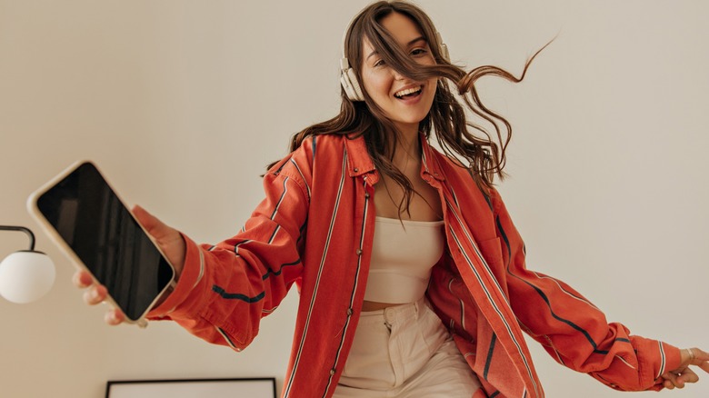 young woman dancing around carefree