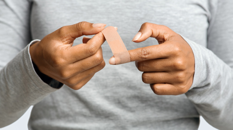 Person wrapping their finger