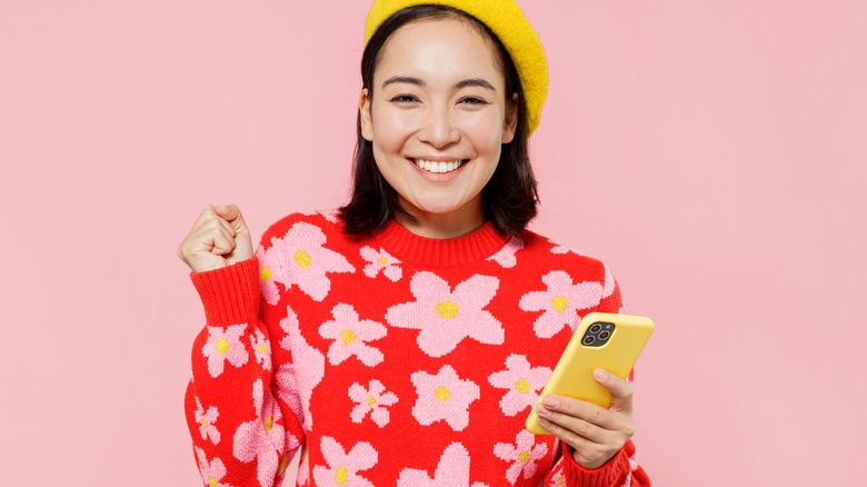Woman wearing red floral top