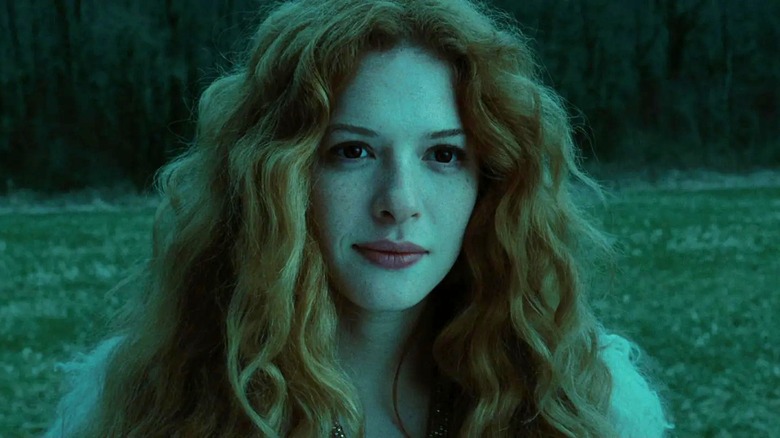 Victoria outside smirking