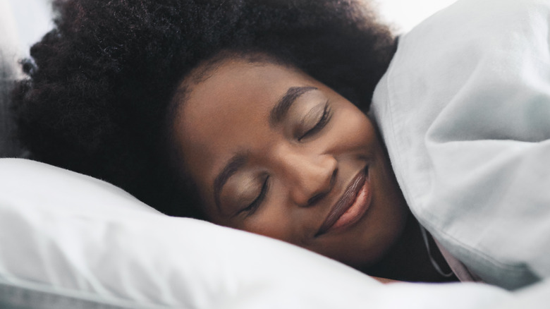 Woman sleeping in bed