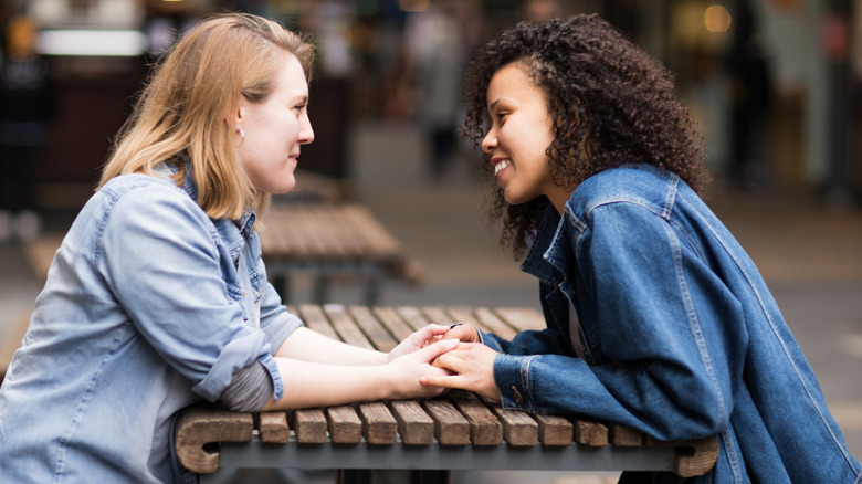 Couple holding hands and smiling