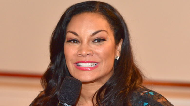 Egypt Sherrod smiling with her usual heavy eyeliner and pink lips