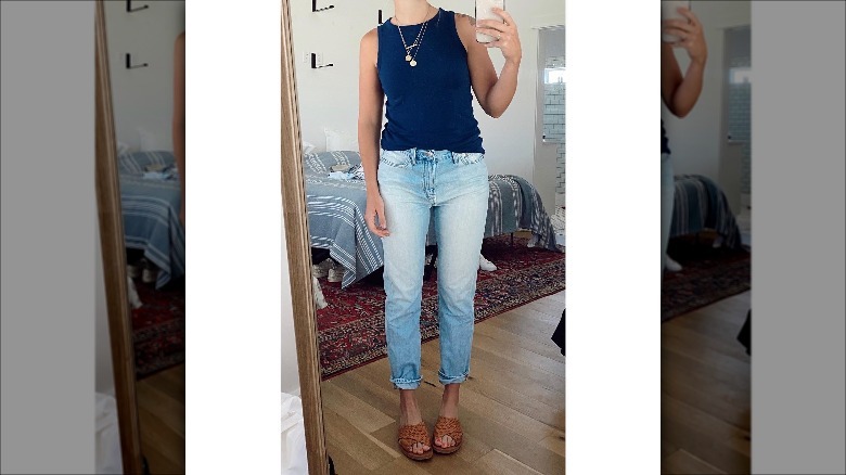 Woman taking selfie of outfit