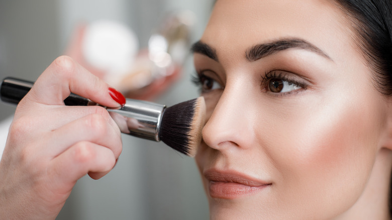 Woman getting her makeup done