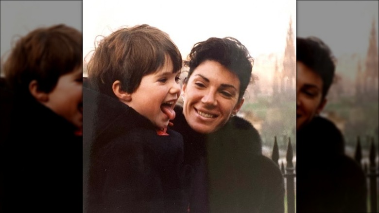 Hilary Farr smiling while looking at her son