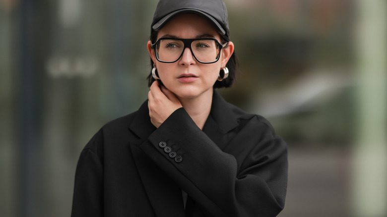 Woman wearing chunky silver hoops