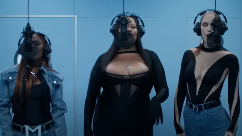 three women singing together