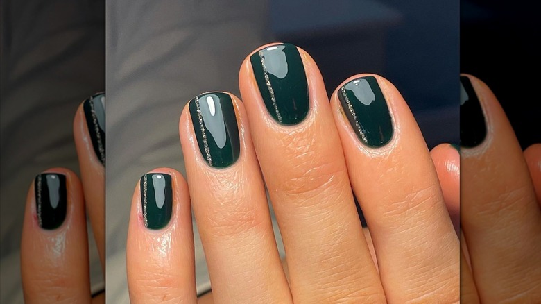 shiny green nails with artwork