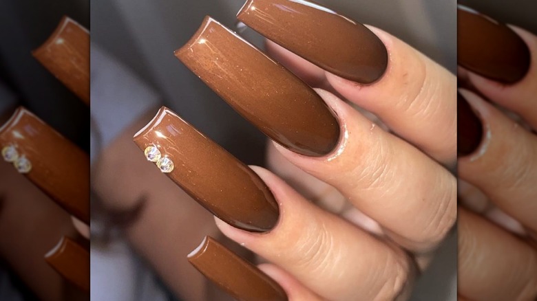 Woman with gems on her nails